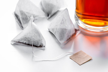 Cup of tea with teabags on white background mock up