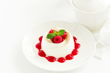 Delicious Italian dessert panna cotta with berries and berry sauce. Valentine's Day.