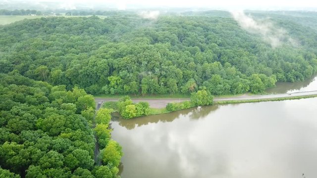 Reverse shot over the trees and swamp in the mountains