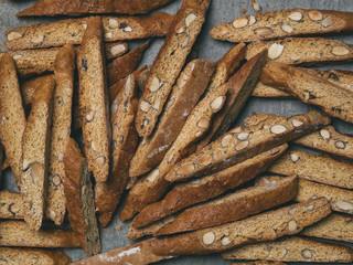 Italian biscuits Biscotti laid out randomly on a baking sheet.