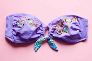 Swimsuit on pink background - pop art design, minimalism, flat lay