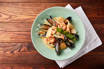 Assorted seafood with creamy sauce and parmesan