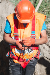 Close up of engineer in field checking device indicator