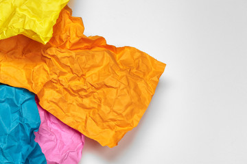 close up of a crumpled paper with curled edge on white background