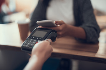Fototapeta premium Close up of contactless payment by phone