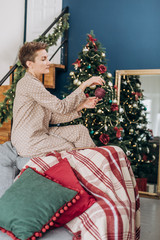 Obraz na płótnie Canvas girl pajamas gift boxes decor christmas tree
