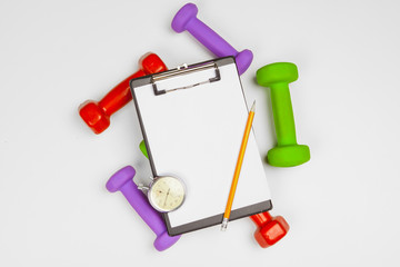 Mockup clipboard with Gym equipment dumbbell on white background