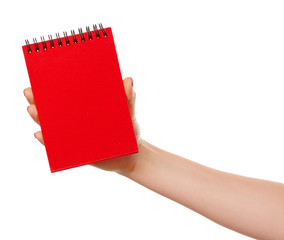 Notebook  in hand. Isolated on white background.