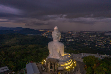 aerial view Phuket big Buddha in twilight. Phuket Big Buddha is one of the island most important and revered landmarks on Phuket island.. © Narong Niemhom