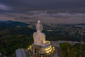 Fototapeta premium aerial view Phuket big Buddha in twilight. Phuket Big Buddha is one of the island most important and revered landmarks on Phuket island..
