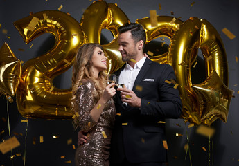 Loving couple making a toast to New Year