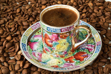 Coffee cup and beans on a white background.