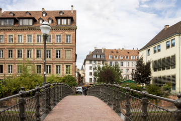 Strasbourg's cityscape with a foot-bridge over the Ill river