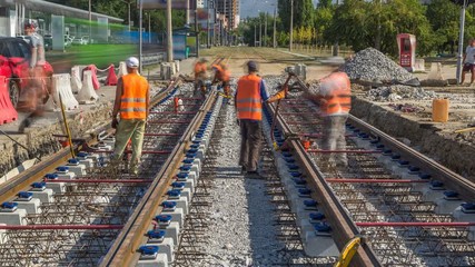 Repair works on the street timelapse. Laying of new tram rails on a city street