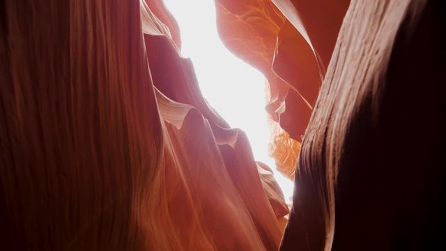 Motion Through A Beautiful Canyon With Red Sandstone Walls And Wavy Protrusions