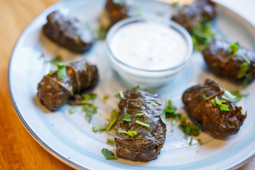 Dolma - traditional asian meat food with sauce