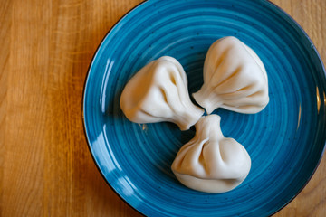 Khinkali with cheese on the plate in restaurant