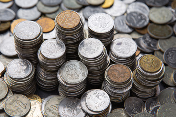Money. Stacks of different rubles coins, background of coins