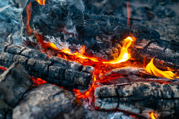 Burning coals close-up outdoors