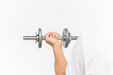 Fototapeta na wymiar Muscular guy arm doing exercises with dumbbell on white with copy text space, sporty guy lifting dumbbell over a white background.