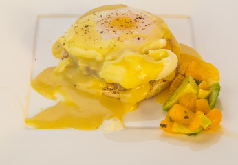 Eggs Benedict with Spicy Fruit Salad