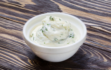 White sauce on wooden background