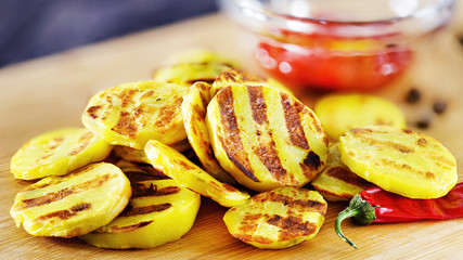 Grilled potatoes with sauce