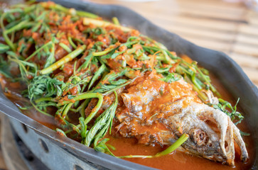 Hot and sour soup sea bass selective focus