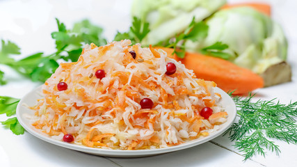 Salted cabbage in a plate on the table