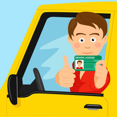 Young happy boy showing his new driver license sitting in his car