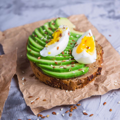 Beautiful healthy snack - avocado sandwich with egg. Vegetarian food concept