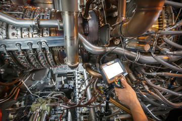 Inspection of a gas turbine engine using a Video Endoscope. Search for defects inside the turbine and shooting on video, photos using a measuring instrument.