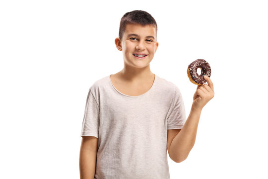 Smiling boy holding a chocolate donut
