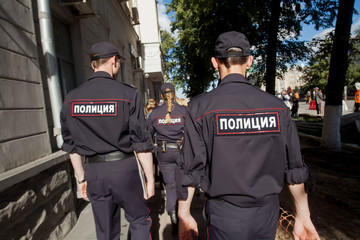 Russian policeman in uniform with the inscription