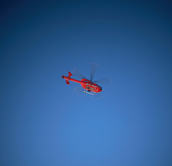 red helicopter in the mountains