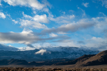 cloudy November sky over Eastern Sierra Nevada hills, mountains, desert valley, California, USA