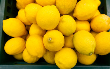 Lemon raw many on the basket in market background and department store. displayed is sale, Vegetables for health. Foods concept..