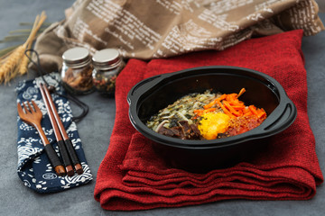 Bibimbap Rice, vegetables, minced marinated beef, spicy sauce and egg yolk