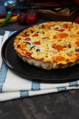 VEGETABLE PIE WITH CHERRY TOMATOES, GRILLED PEPPERS AND COURGETTES With fresh eggs and fresh cream