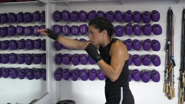 Woman practicing shadow boxing