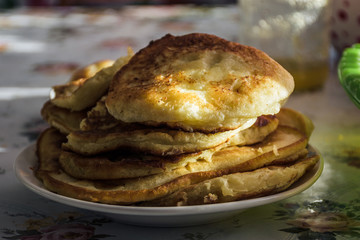 Tasty pancakes on a white dish