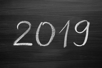 2019 Happy New Year, written with a chalk on the blackboard