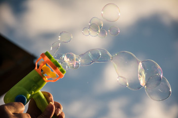 Image of toy gun shooting bubbles