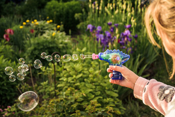 Image of toy gun shooting bubbles