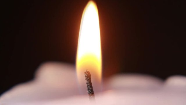 Close-Up Of Cutting Candle Wick With Scissors.