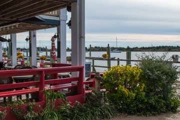 Boats on the water, blue sky above, scenes from historic waterfront Beaufort North Carolina