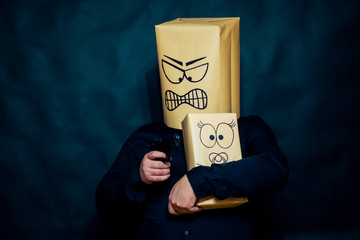 Emotion concept. The man pressed down the kitten to him. Sent the trunk of the gun at him. The...