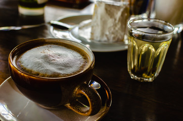 Hot coffee cup served with hot tea in coffee.