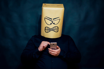 Emotion concept. A man is gaining the number on a mobile phone. The expression on his face means...