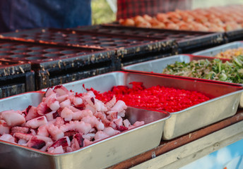 Pile of tentacles for cooking Takoyaki a famous Japanese food at street food market in Japan.